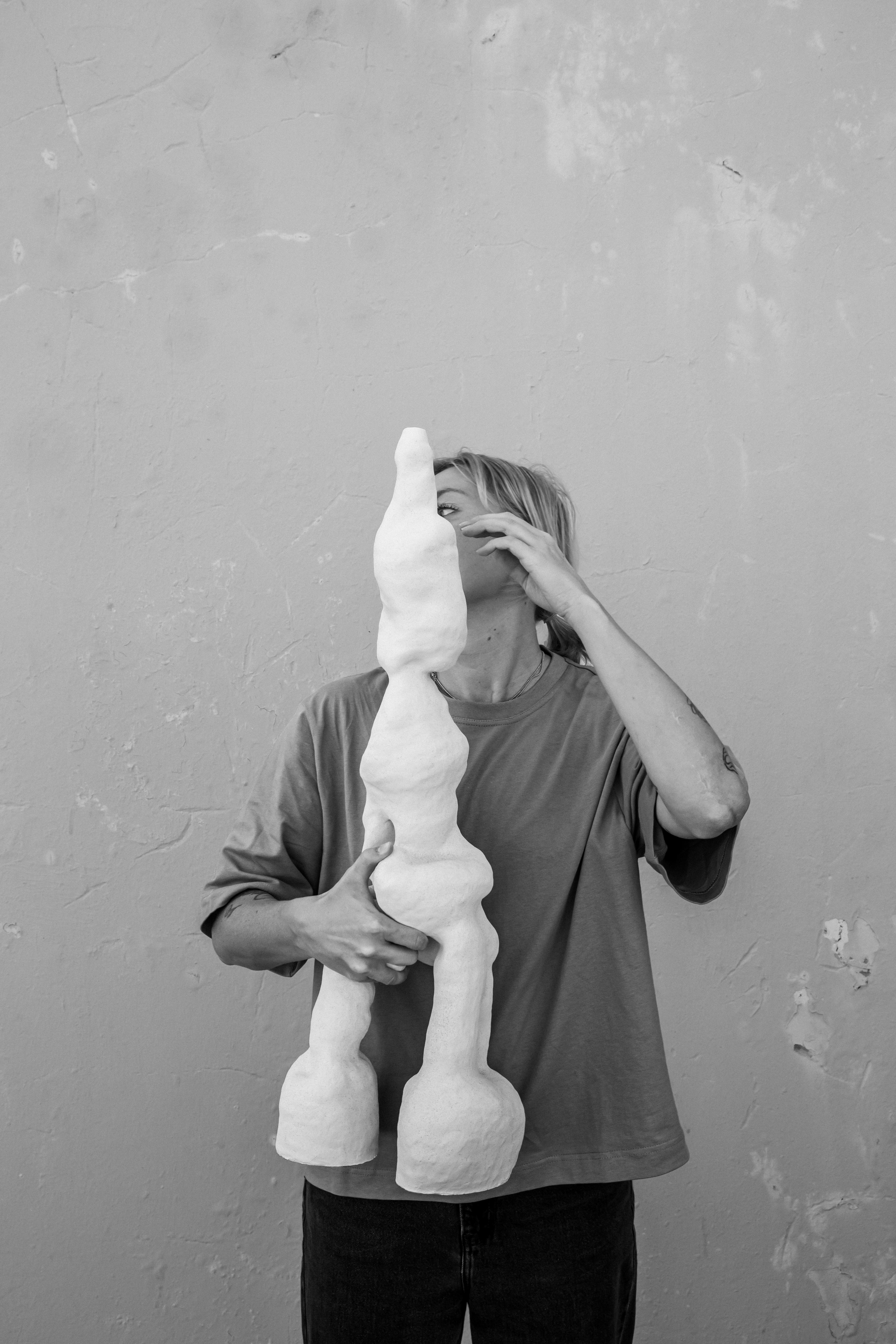 Eveliina holding a sculptural piece